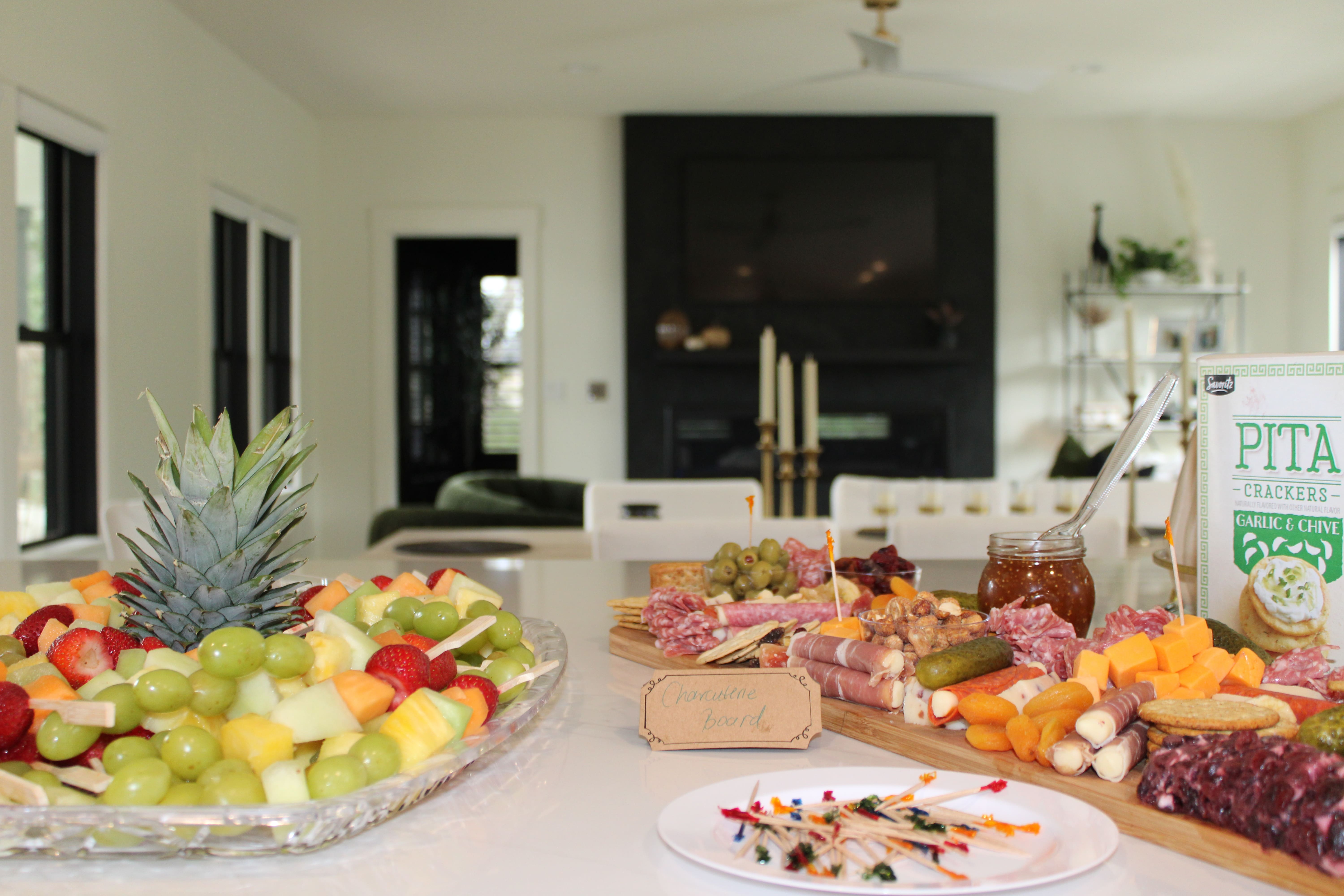 Guests gathered around a Fresh & Exotic catered brunch buffet at a Massachusetts baby shower