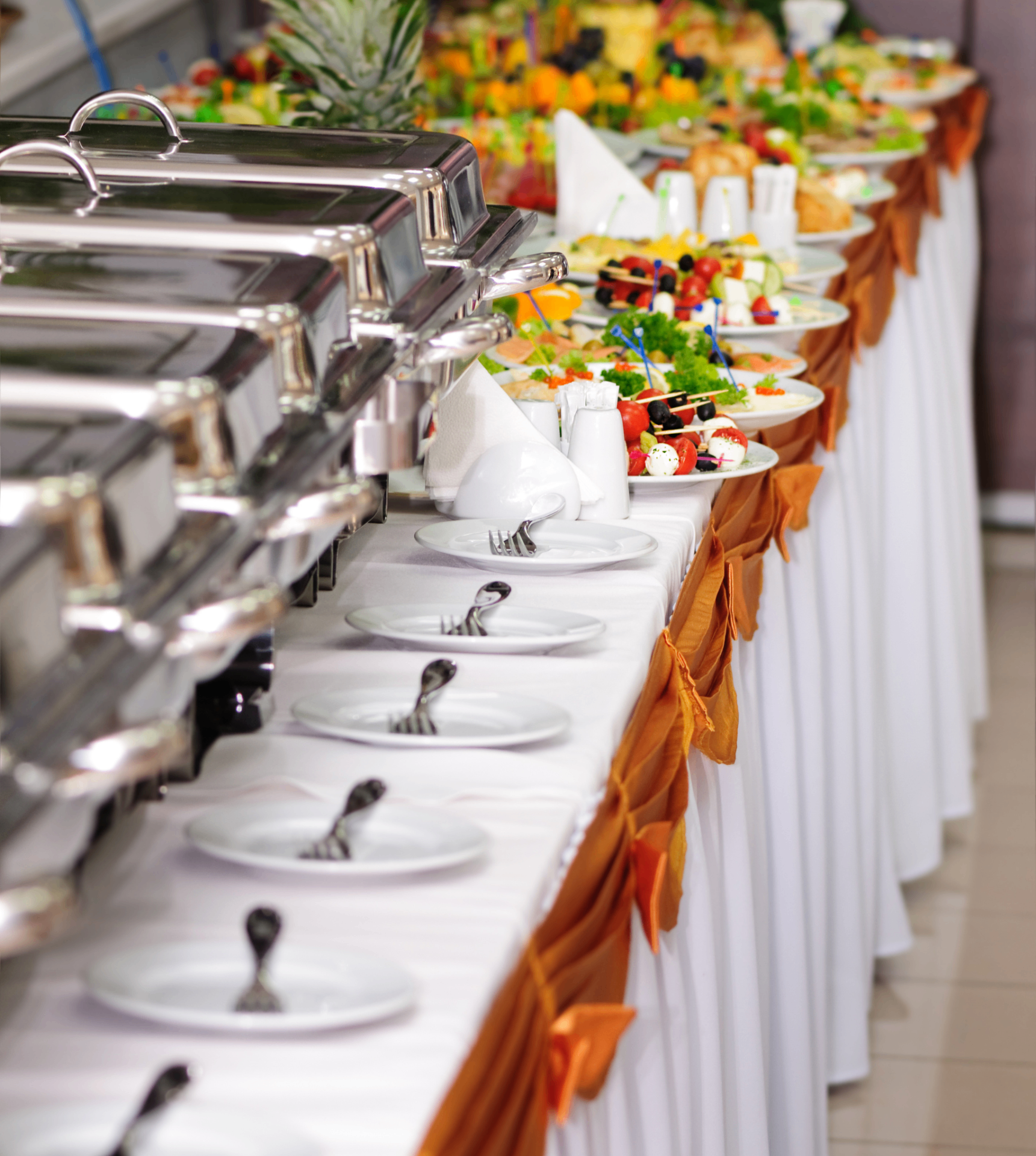 Fresh & Exotic buffet setup with chafing dishes and plated appetizers